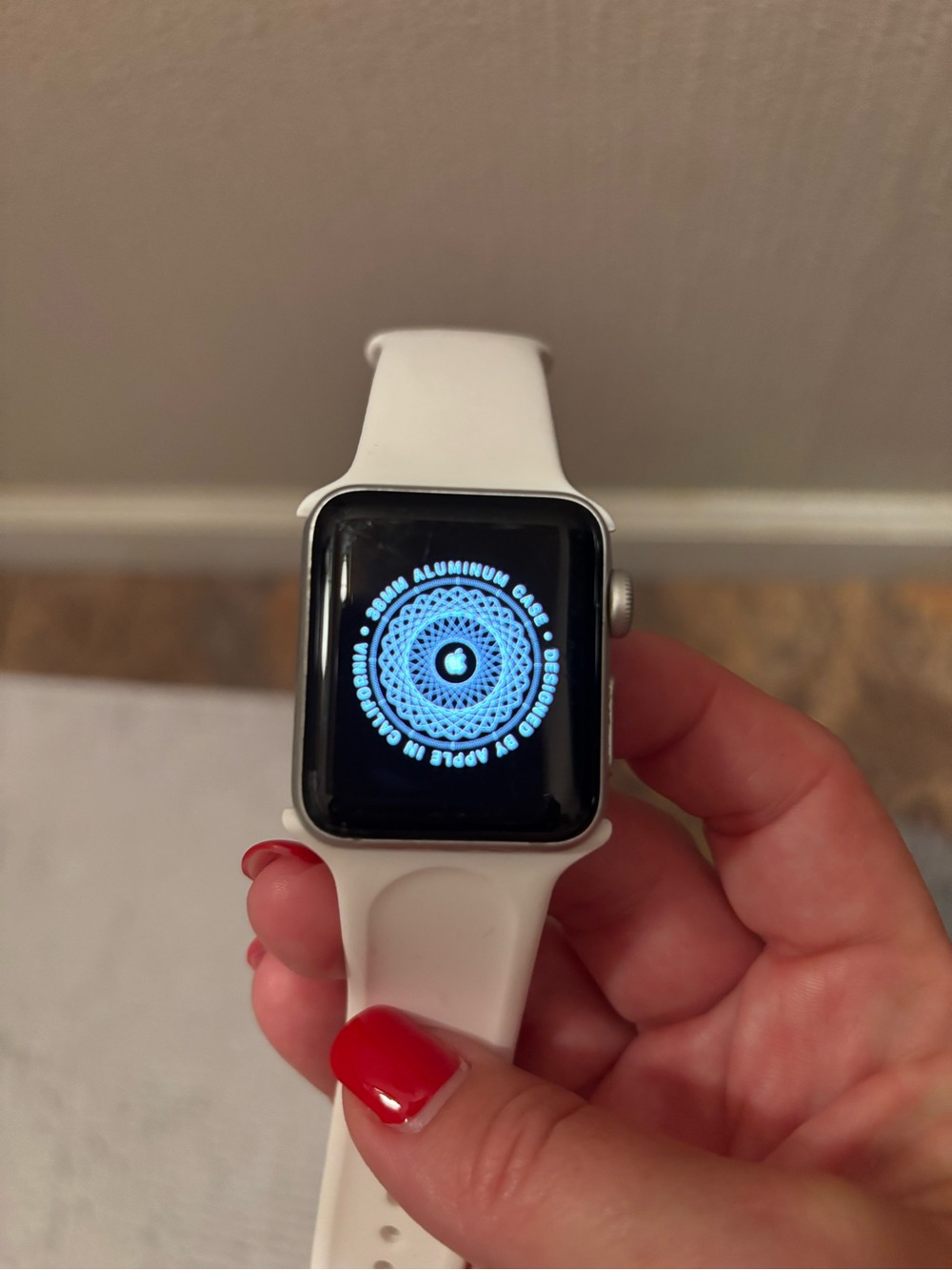 Apple Smartwatch with white Sport Band and Silver Case